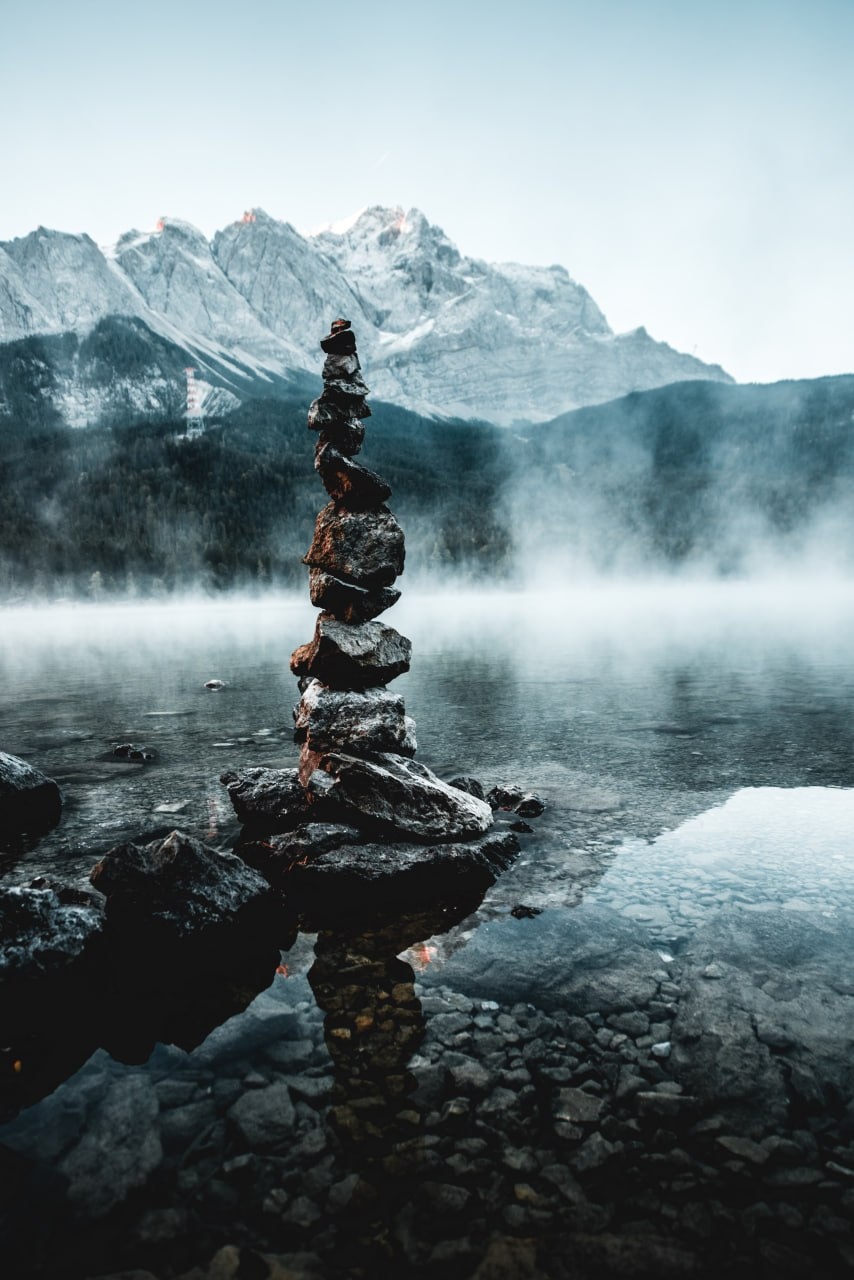 Stone balance in alpine lake